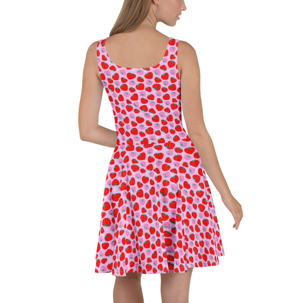 Printful Scrummy Strawberries skater dress with a vibrant all-over strawberry print on white fabric, back view.