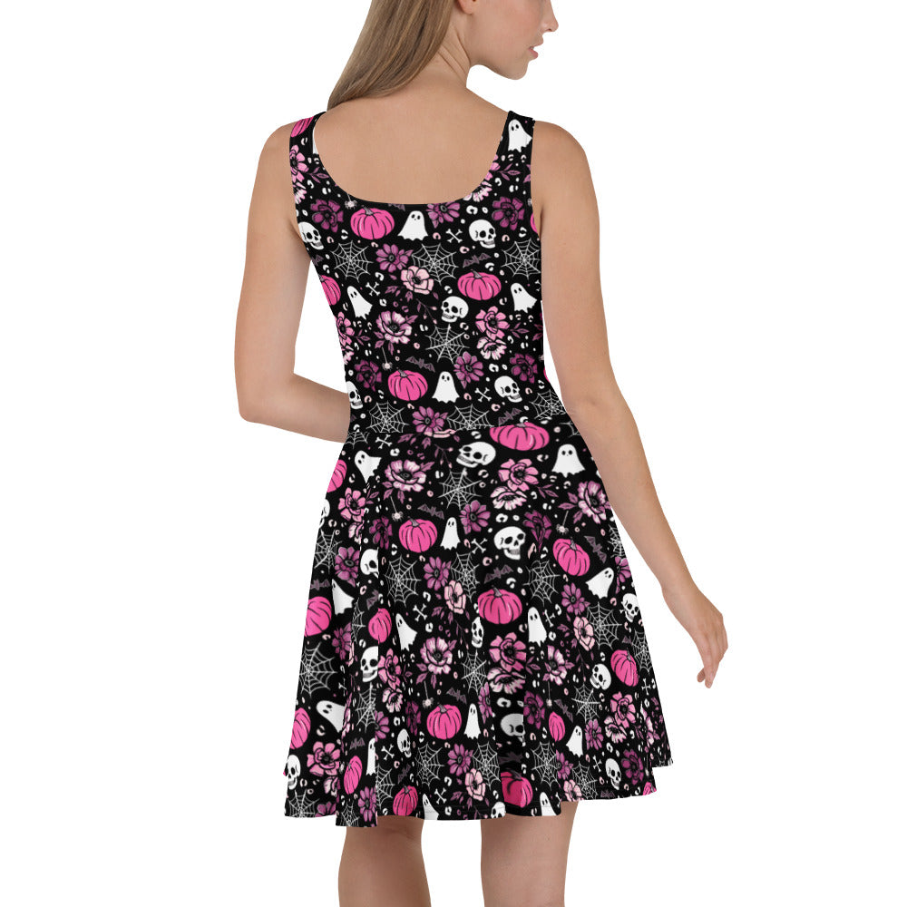 Pink Halloween-themed skater dress by Printful made from recycled fabric, featuring an all-over print design on a white background.