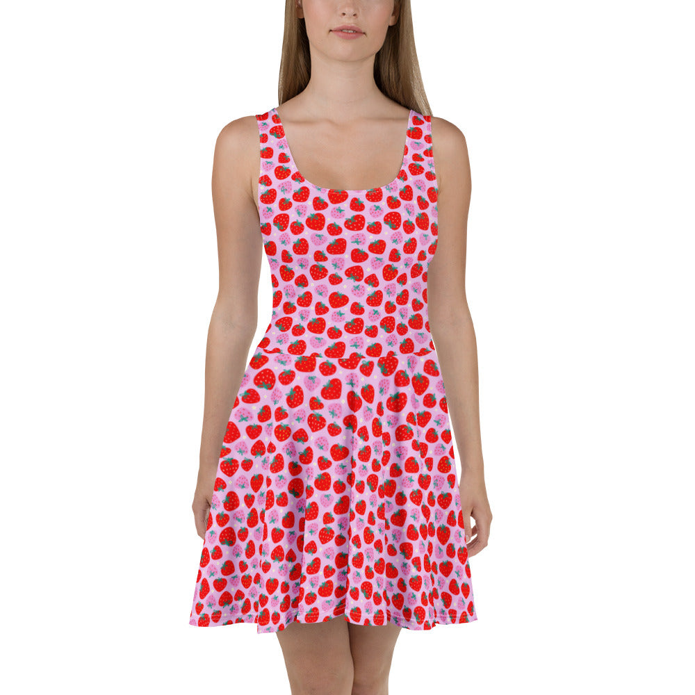 White Scrummy Strawberries Skater Dress by Printful featuring a colorful strawberry print on a flattering, all-over design.