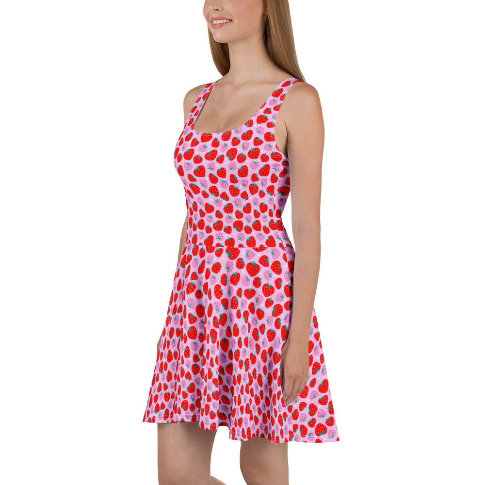 White Scrummy Strawberries skater dress by Printful featuring all-over strawberry print and a flared skirt.