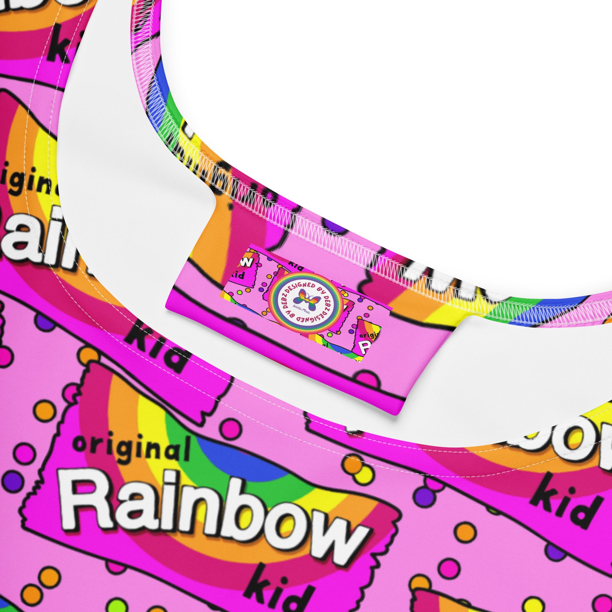 Rainbow Kid skater dress by Designed By Debz with vibrant all-over print on white recycled fabric.