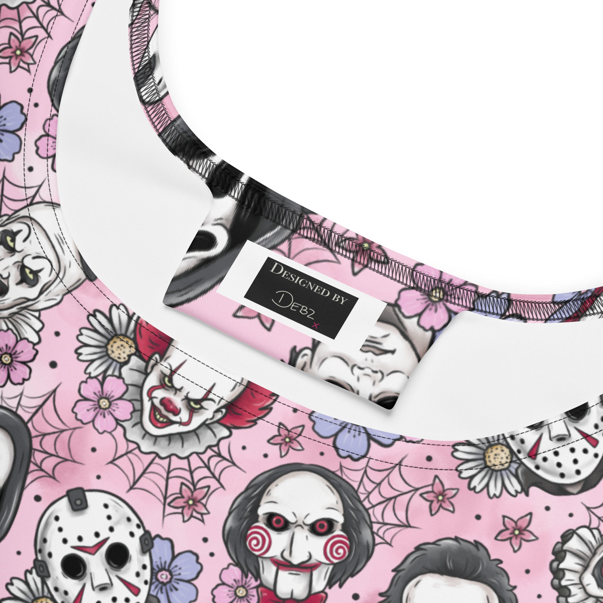 Pink and black print skater dress featuring classic horror movie villains, made by Printful, displayed on a white background.