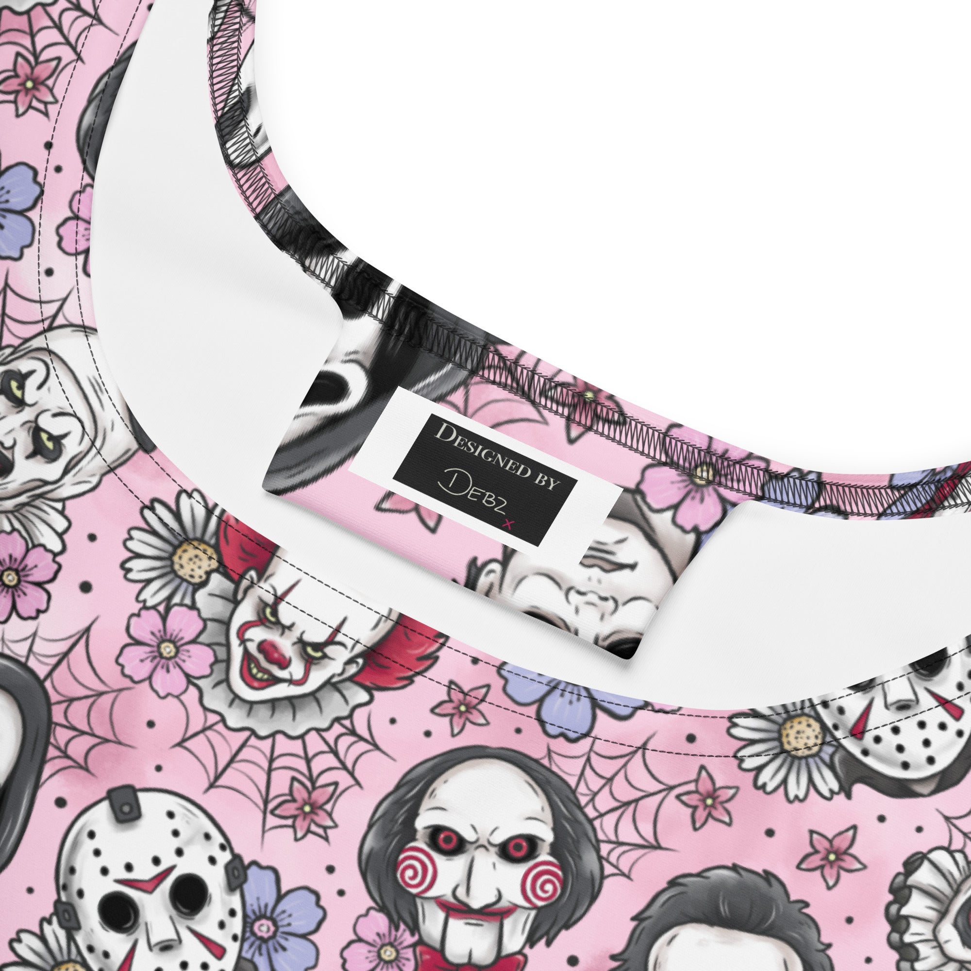 Pink and black print skater dress featuring classic horror movie villains, made by Printful, displayed on a white background.
