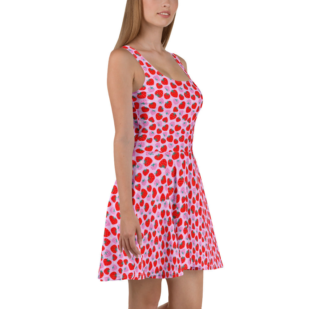 White skater dress with a colorful strawberry print, featuring a fitted bodice and flared skirt, by Printful.