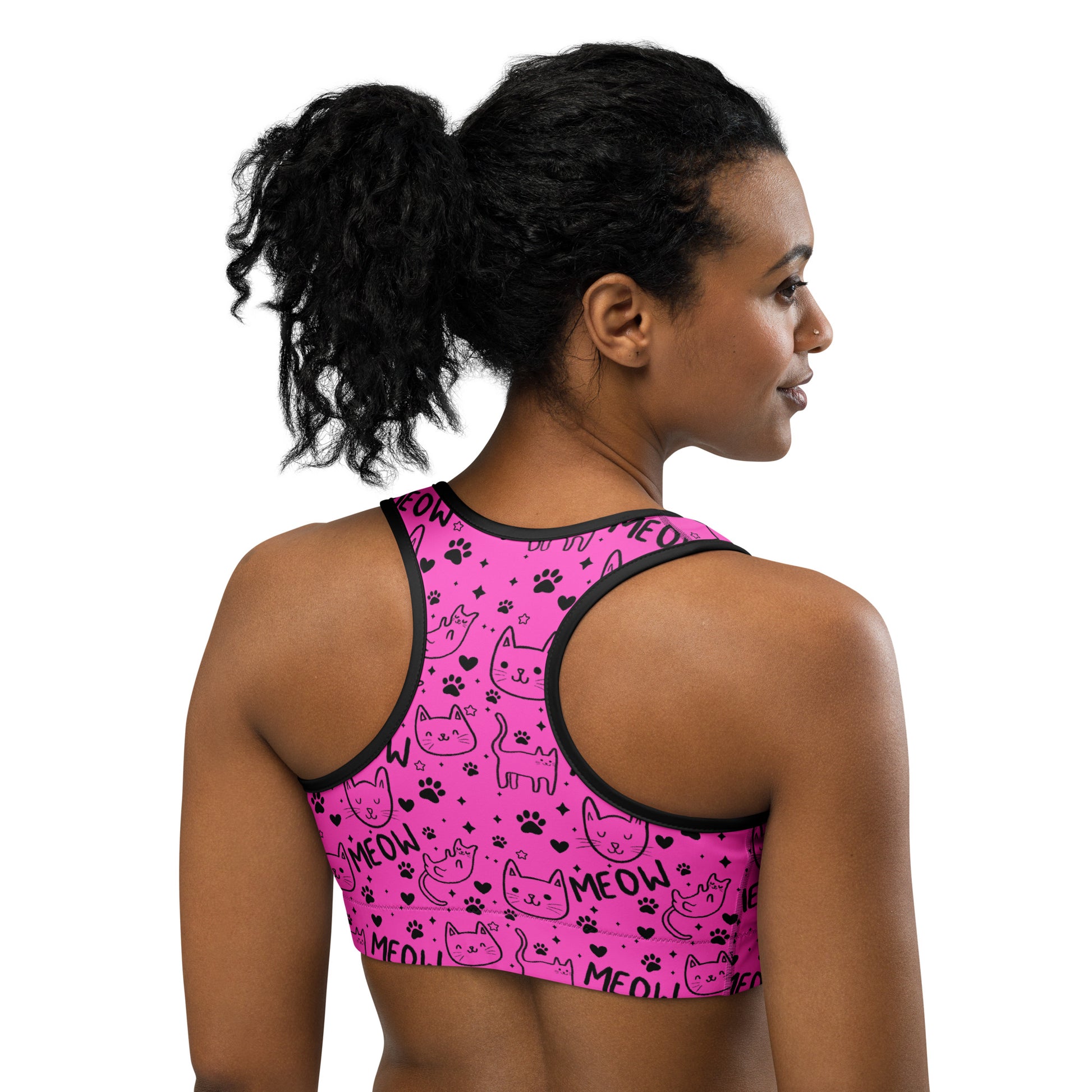 Pink and black Cat Meow print sports bra by Printful, featuring an all-over design, shown from the back in an XS-2XL size.