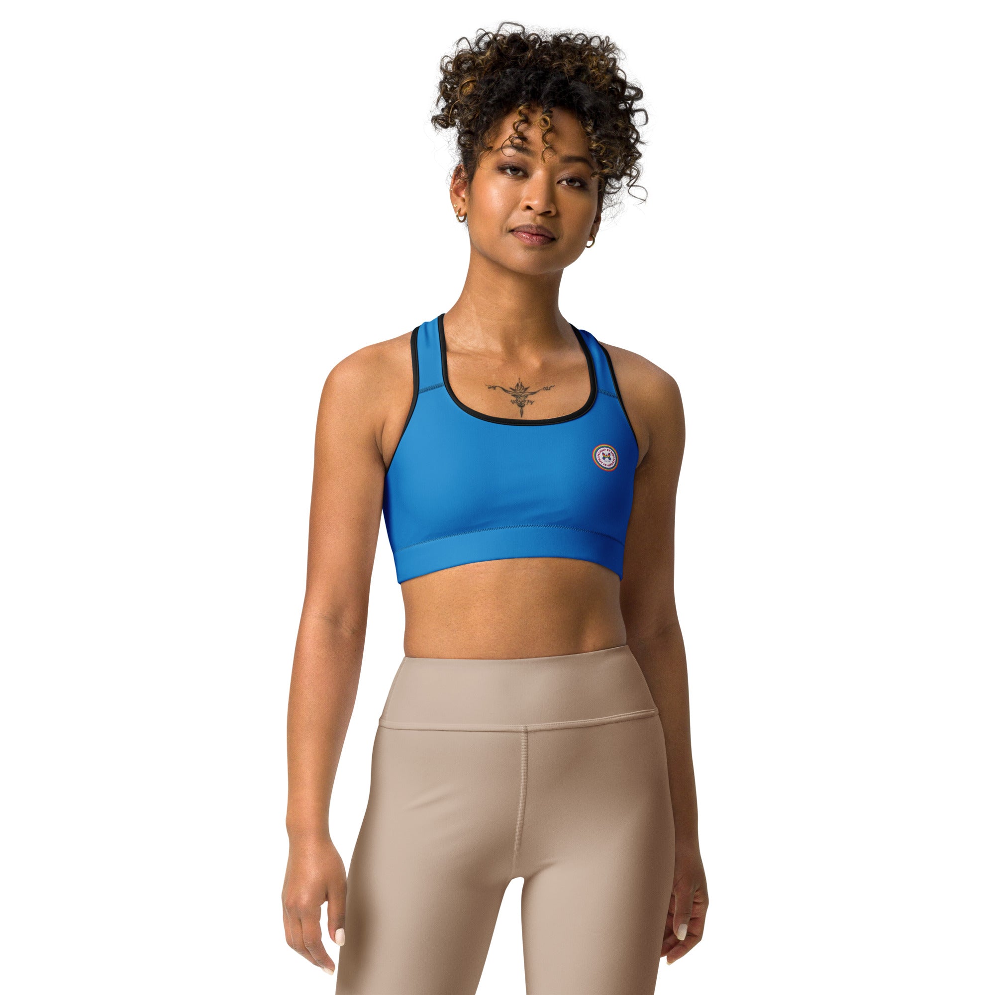 Printful sports bra in black with white binding, front view, all-over print, available in XS to 2XL sizes.