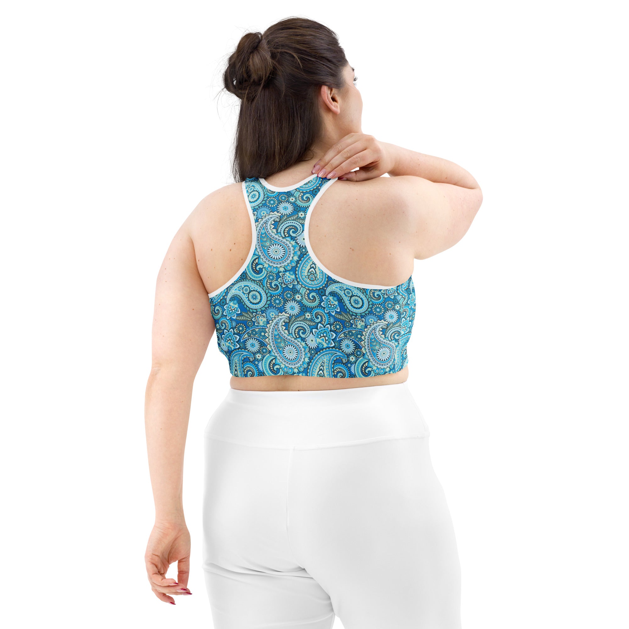 Blue paisley print sports bra from Printful, shown from the back with all-over pattern and white fabric accents, available in XS-2XL.