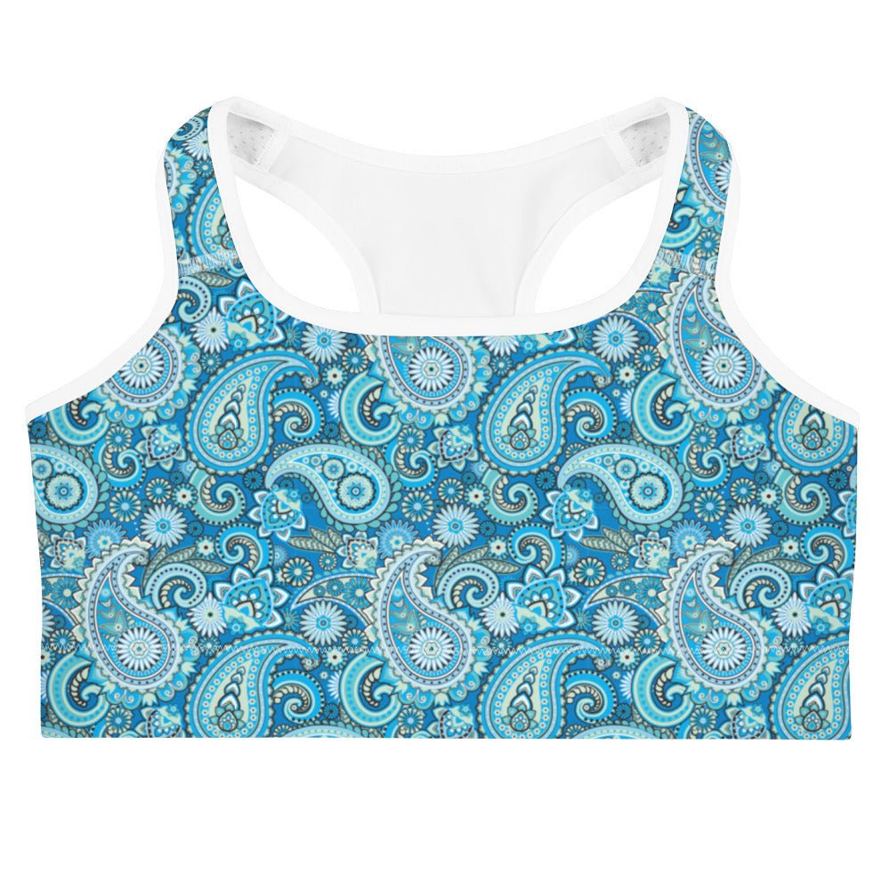 Blue paisley print sports bra by Printful, showing the front view with adjustable straps and supportive design.