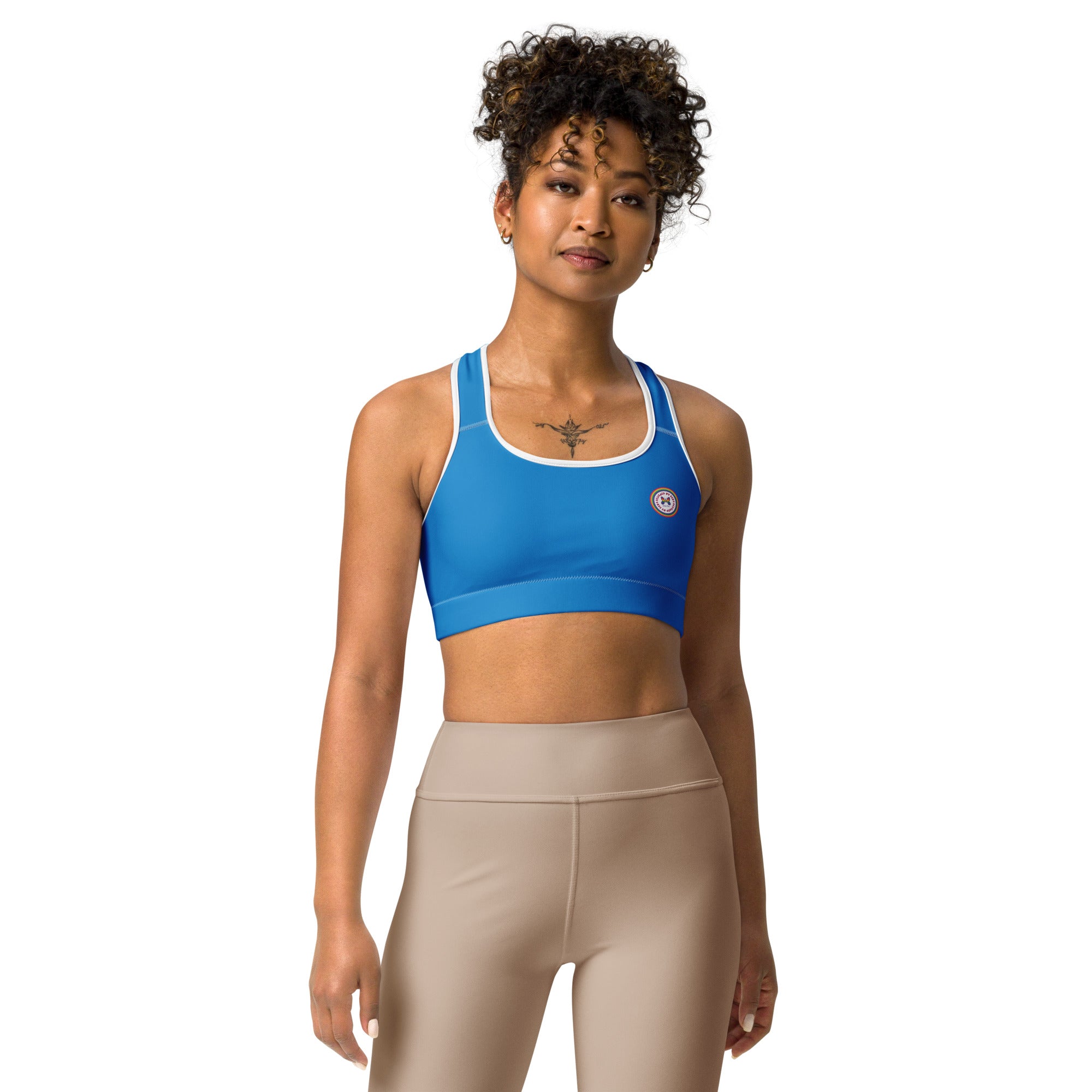 All-over print white sports bra by Printful with black or white binding, featuring a front view in size XS to 2XL.
