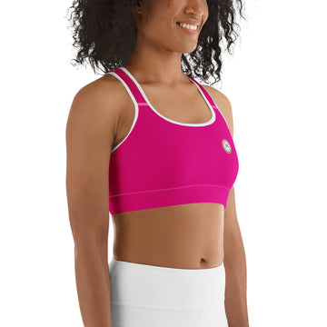 Hot pink all-over-print sports bra by Designed By Debz, made to order, shown from the right side with white accents.