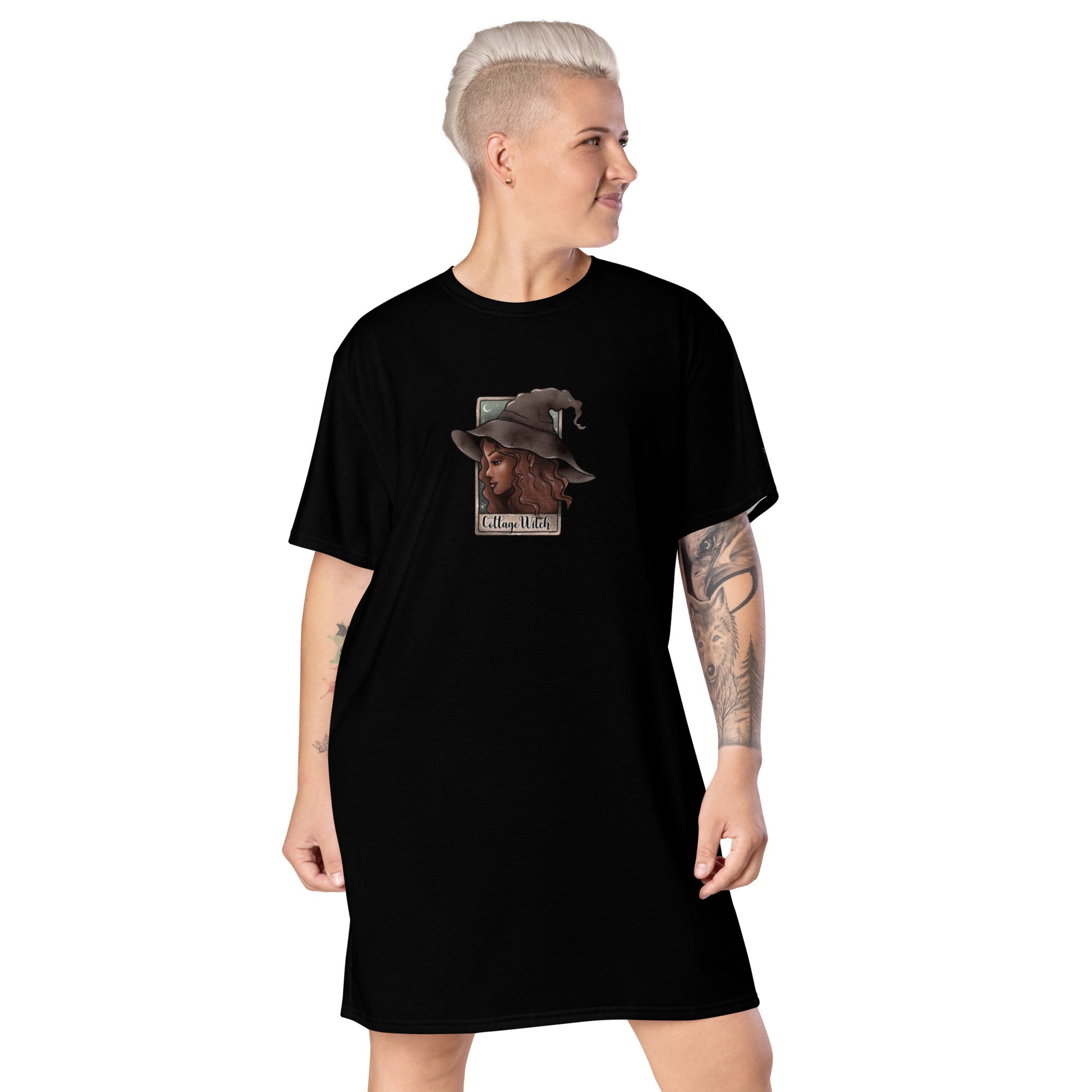 Black Cottage Witch T-Shirt Dress by Printful with all-over white witch print, front view, available in XS to 3XL size.