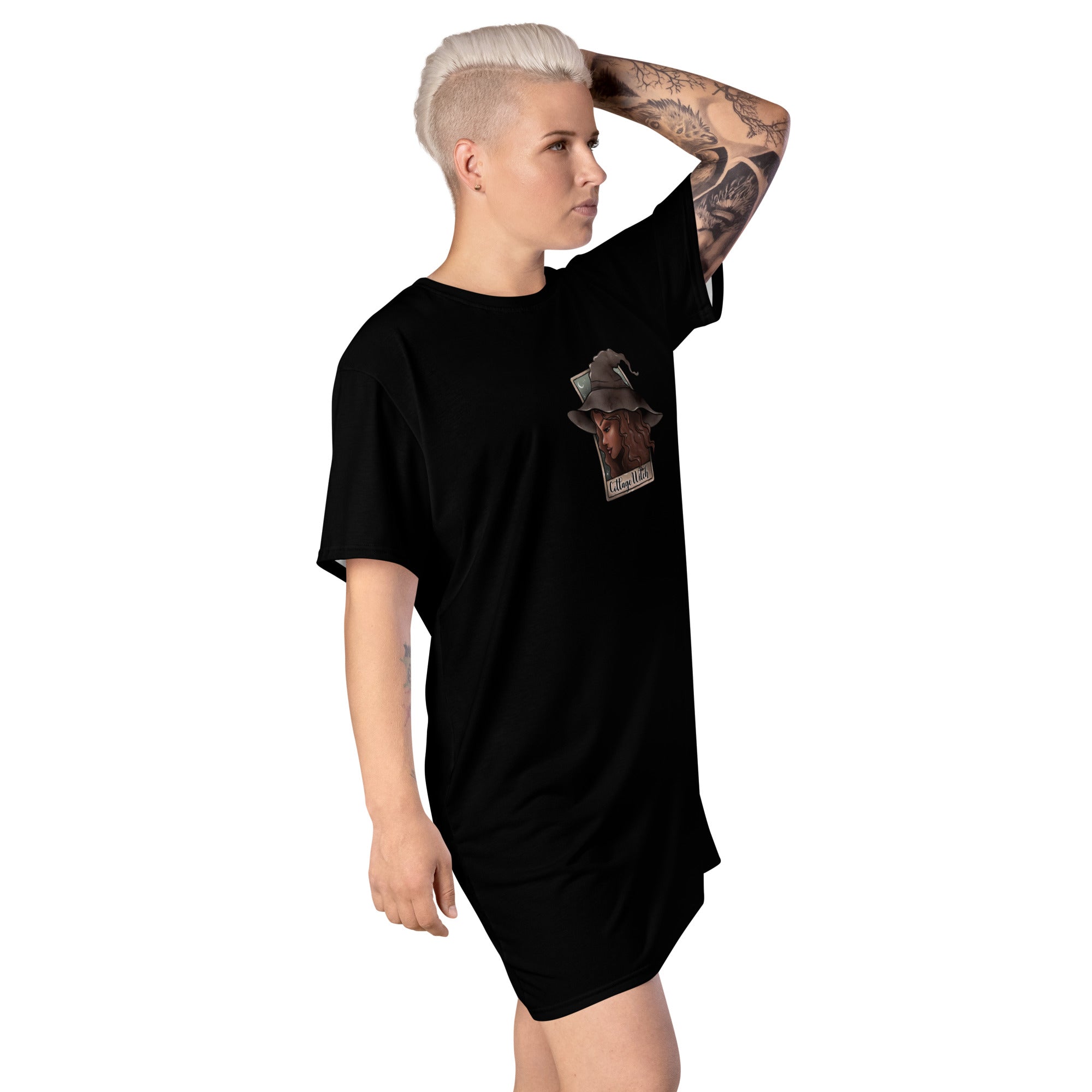 Black Cottage Witch T-Shirt Dress by Printful, featuring all-over white print, shown from the right front view.