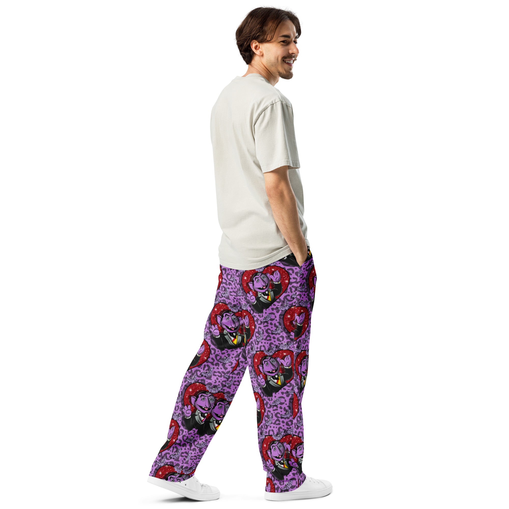 Unisex white wide-leg joggers with all-over print from Designed By Debz, featuring a casual cut-sew style and relaxed fit.