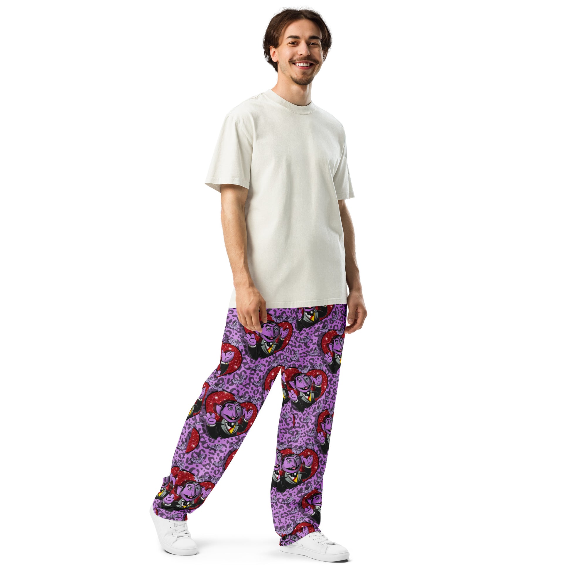 Unisex white wide-leg joggers with all-over print from Designed By Debz, featuring a relaxed fit and casual style.