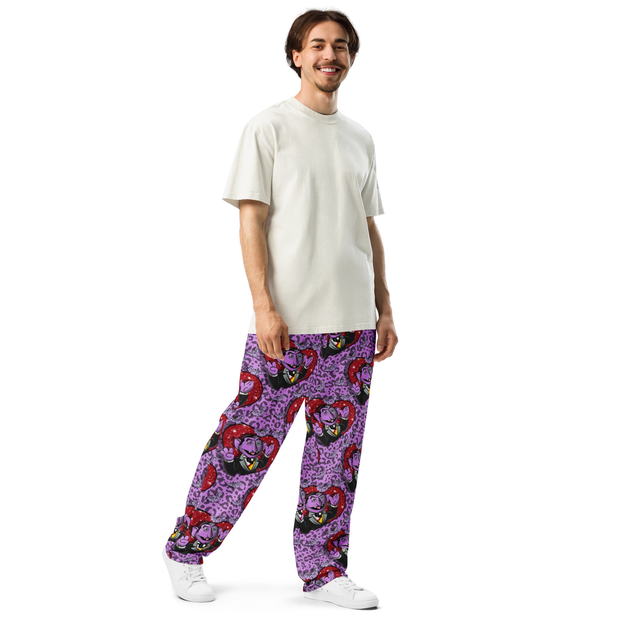 Unisex white wide-leg joggers with all-over print from Designed By Debz, featuring a relaxed fit and casual style.