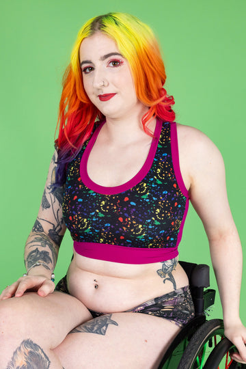 Designed By Debz Wilde Mode multi-print compression top with lower neckline, made from recycled materials, offering comfort and support.