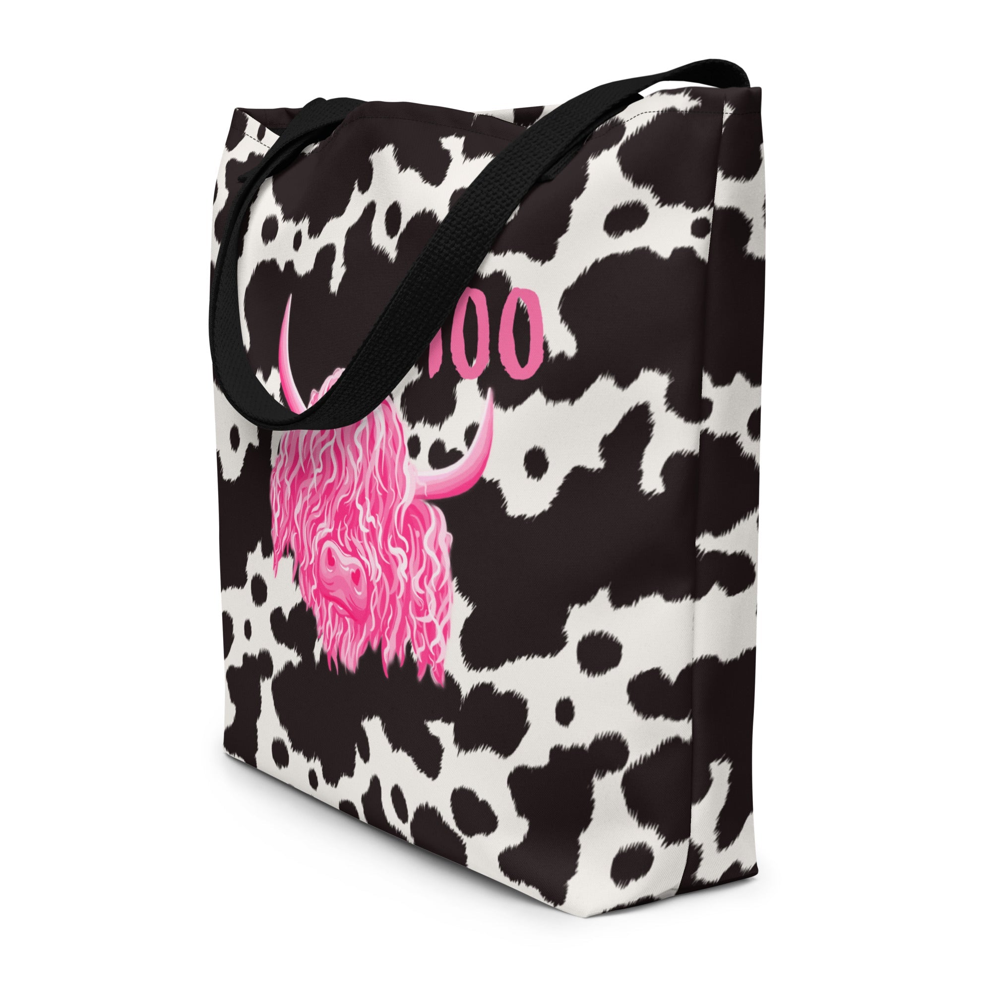 Black and white cow print tote bag by Designed By Debz, showcasing a cute cow pattern on a spacious shopping bag.