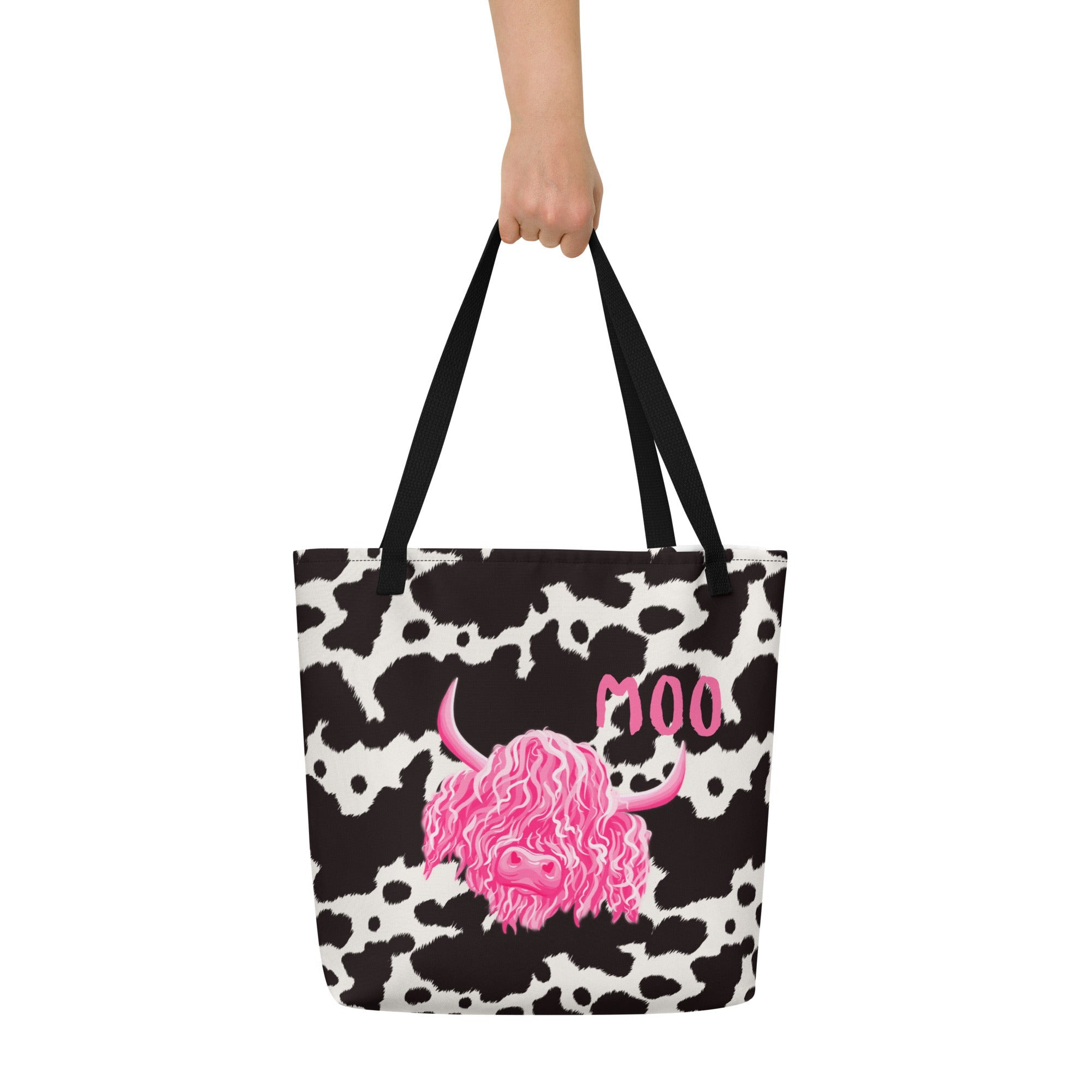 Black and white cow print tote bag by Designed By Debz, featuring a spacious shopper design with playful cow pattern.