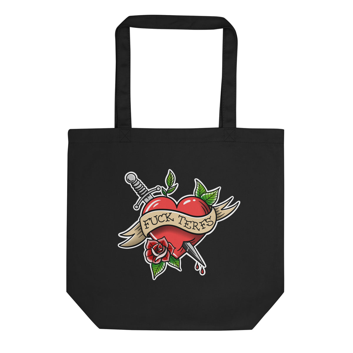 A black canvas tote bag with a traditional tattoo-style graphic of a red heart pierced by a sword, a rose, and a banner reading 'FUCK TERFS'.