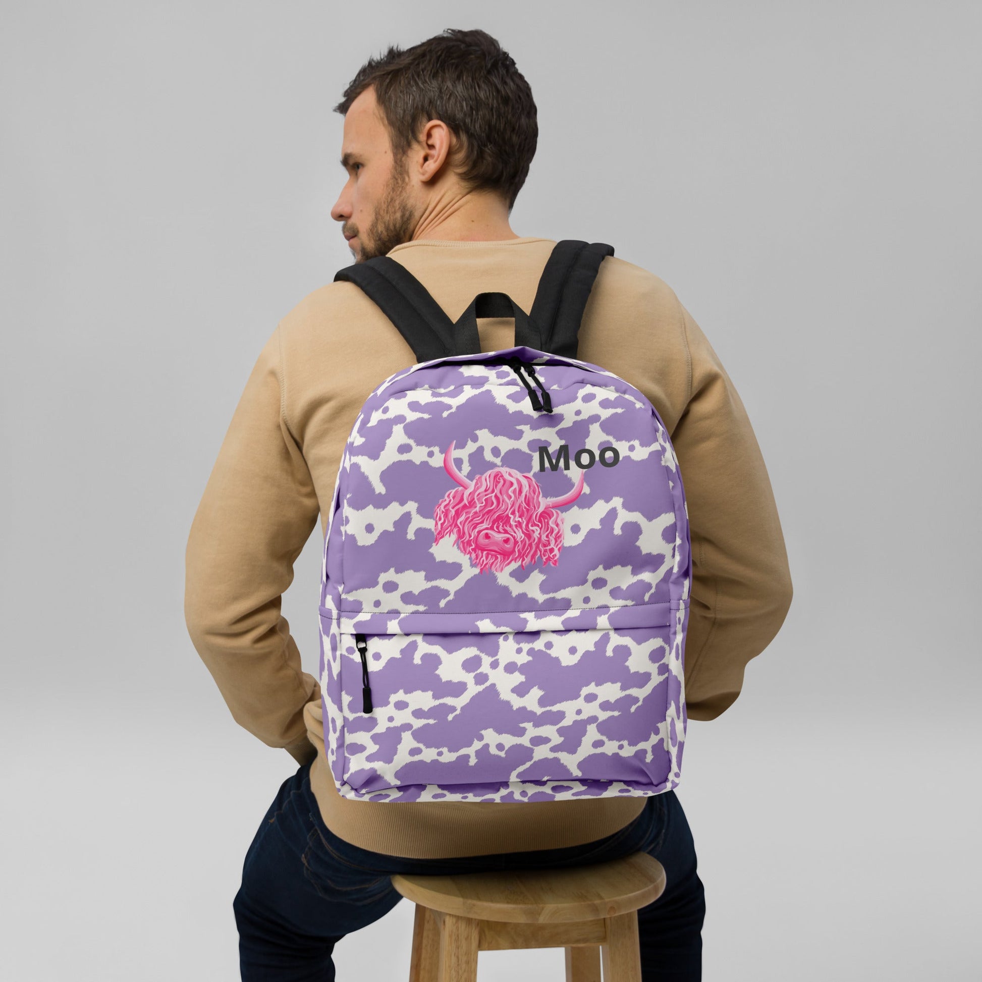 Moo Lilac Cow Print Backpack by Designed By Debz, pink cow pattern laptop backpack with adjustable straps and spacious interior.