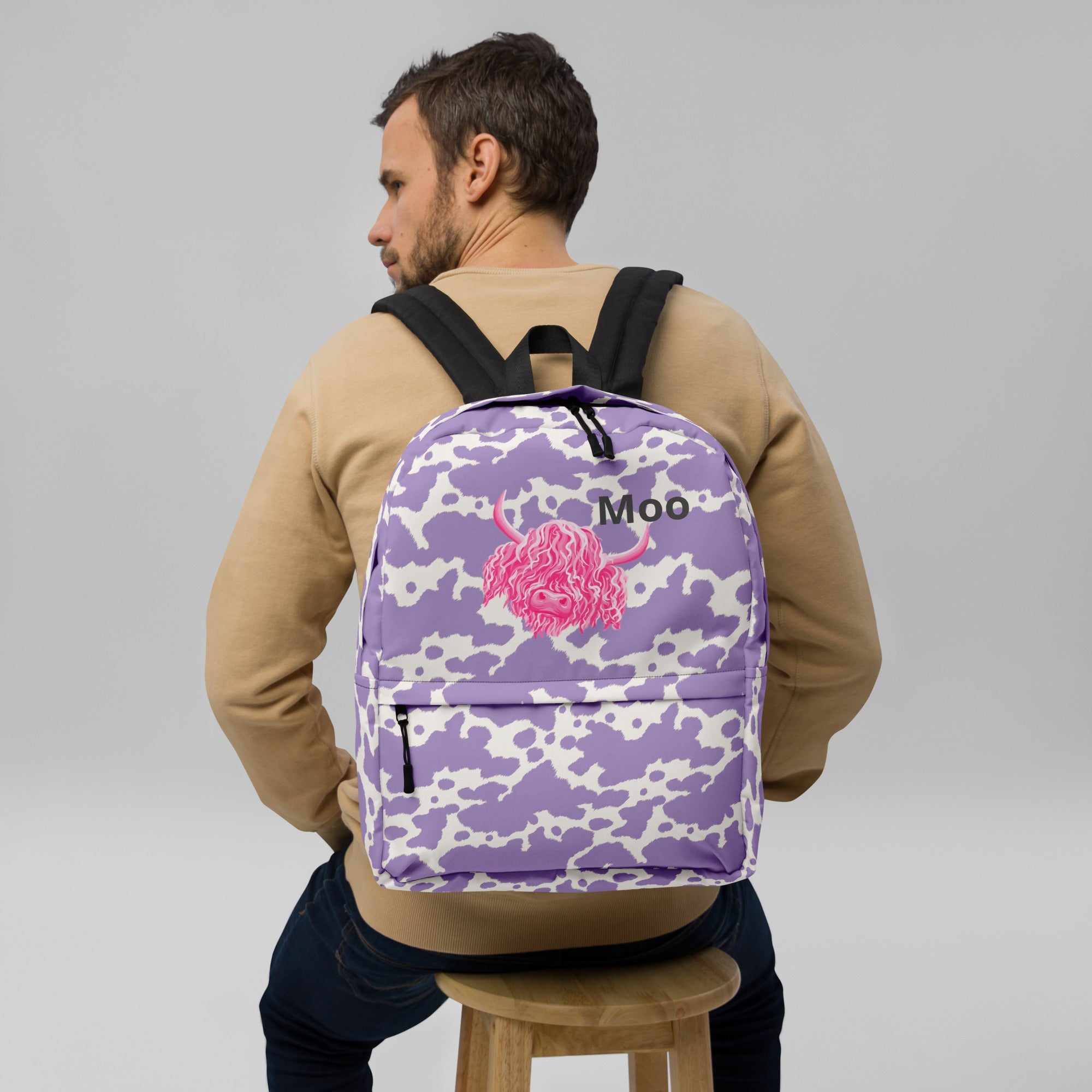 Moo Lilac Cow Print Backpack by Designed By Debz, pink cow pattern laptop backpack with adjustable straps and spacious interior.