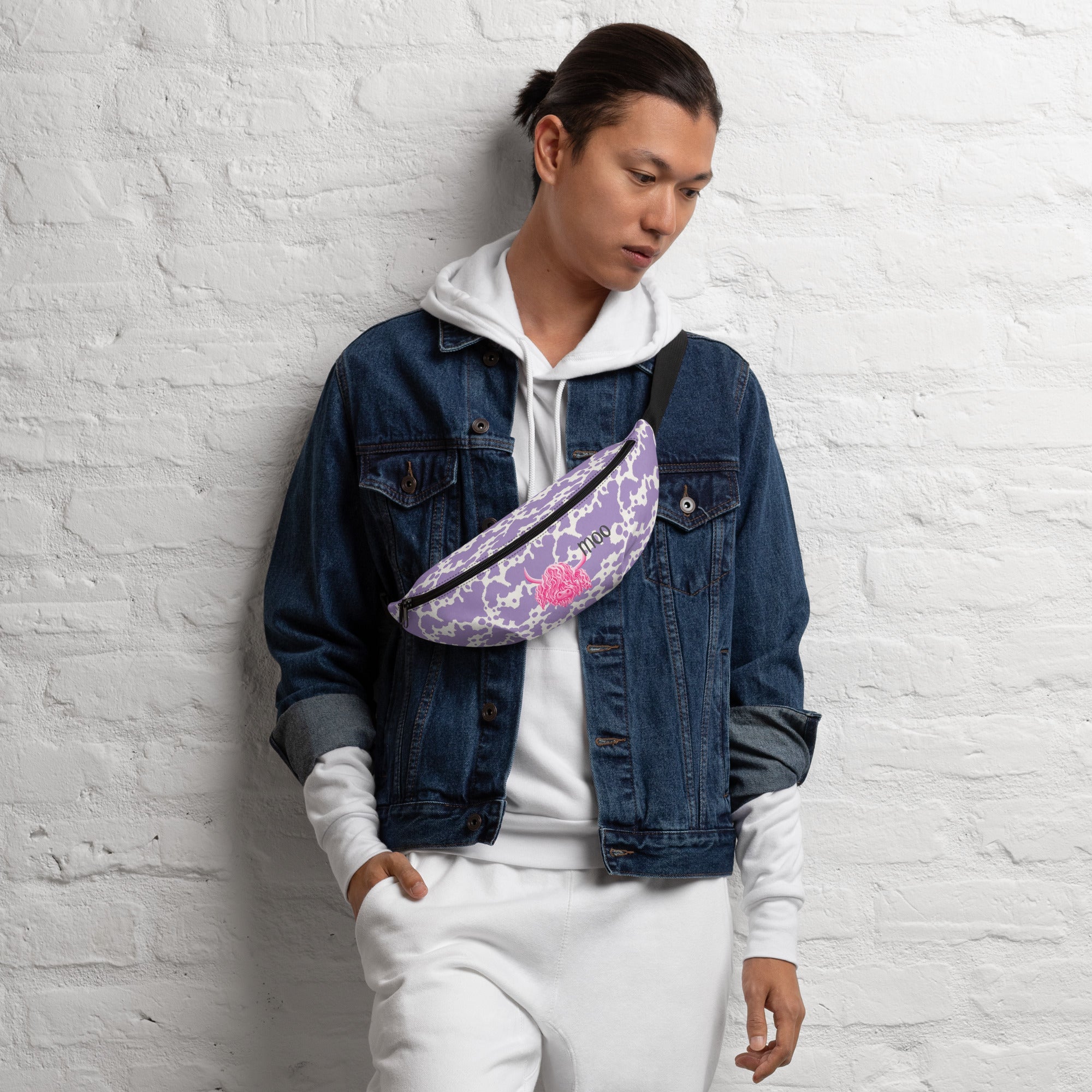 Pink cow print bumbag from Printful featuring a lilac cow pattern, perfect for casual and stylish outings.