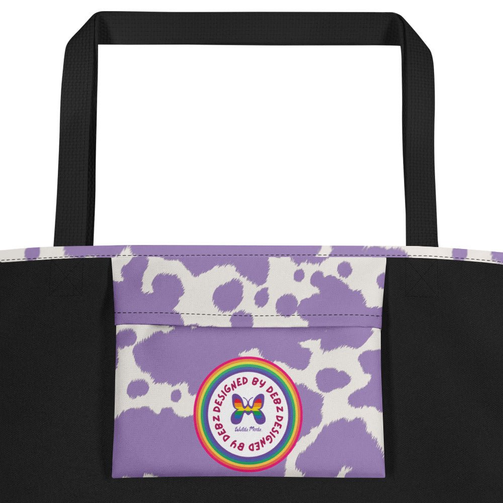 Lilac cow print tote bag by Printful featuring pink cow design, perfect for stylish shopping or everyday use.