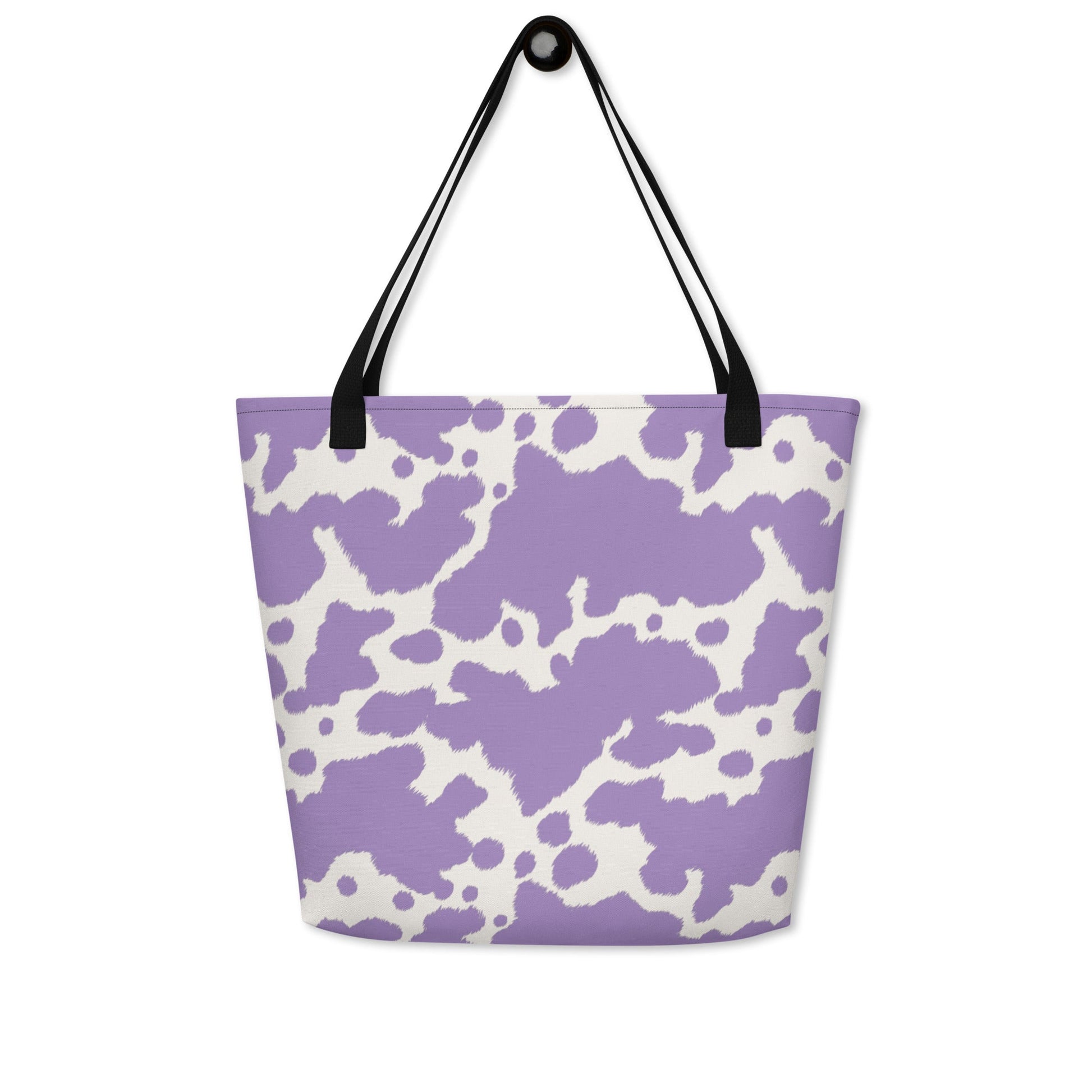 Lilac cow print tote bag by Printful featuring a cute pink cow design, perfect for casual shopping and everyday use.