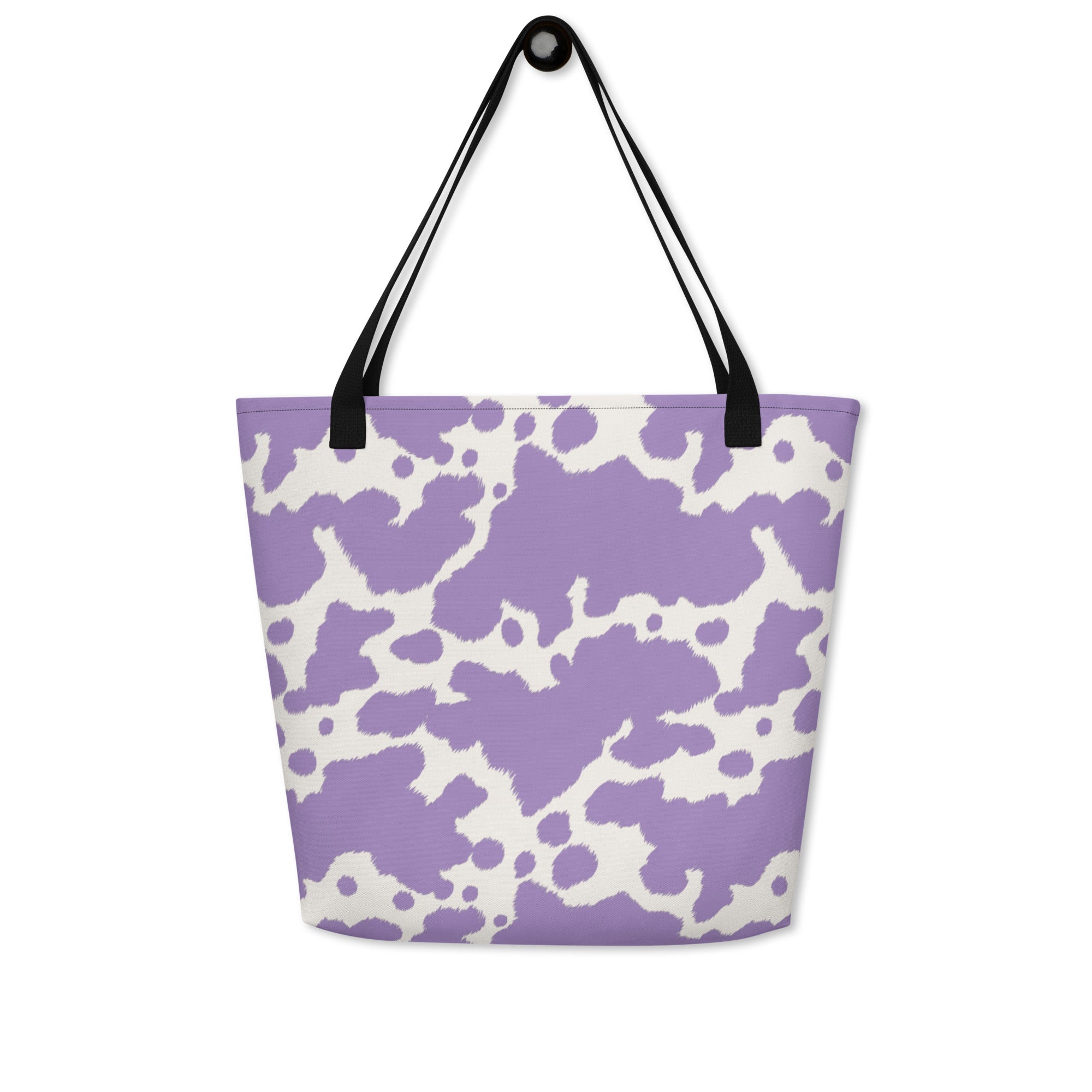 Lilac cow print tote bag by Printful featuring a cute pink cow design, perfect for casual shopping and everyday use.