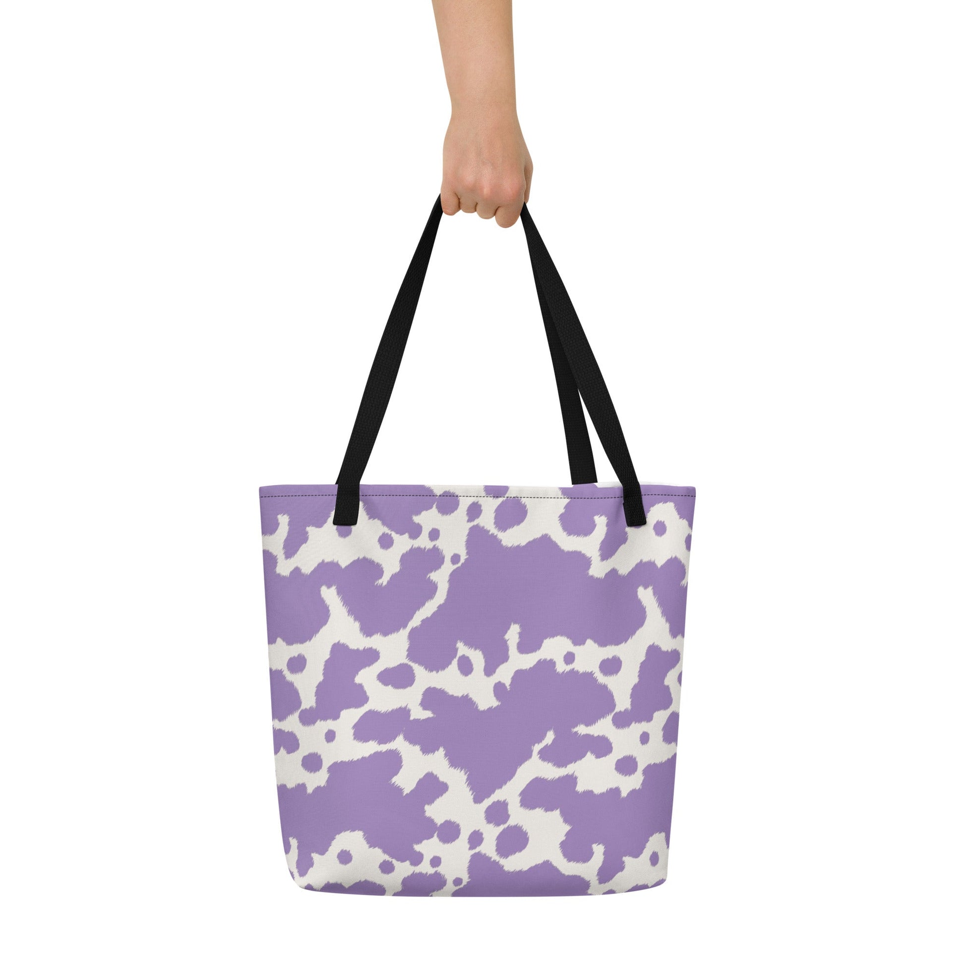Lilac cow print tote bag from Printful featuring a cute pink cow design, perfect for casual shopping or everyday use.