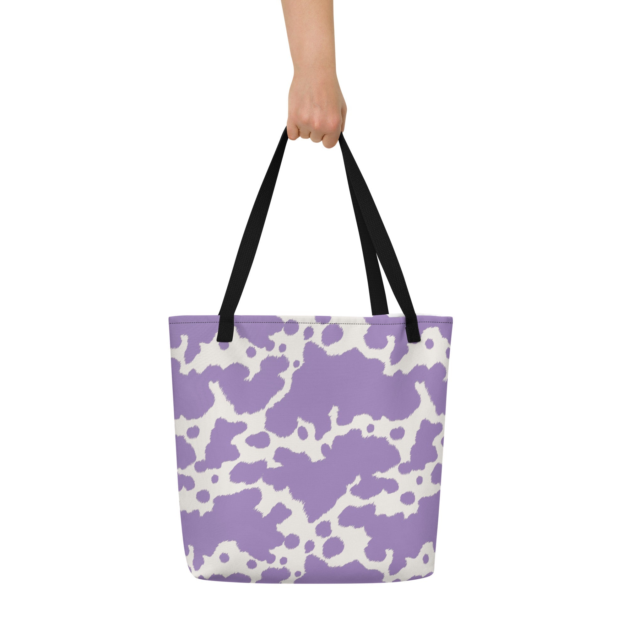 Lilac cow print tote bag from Printful featuring a cute pink cow design, perfect for casual shopping or everyday use.