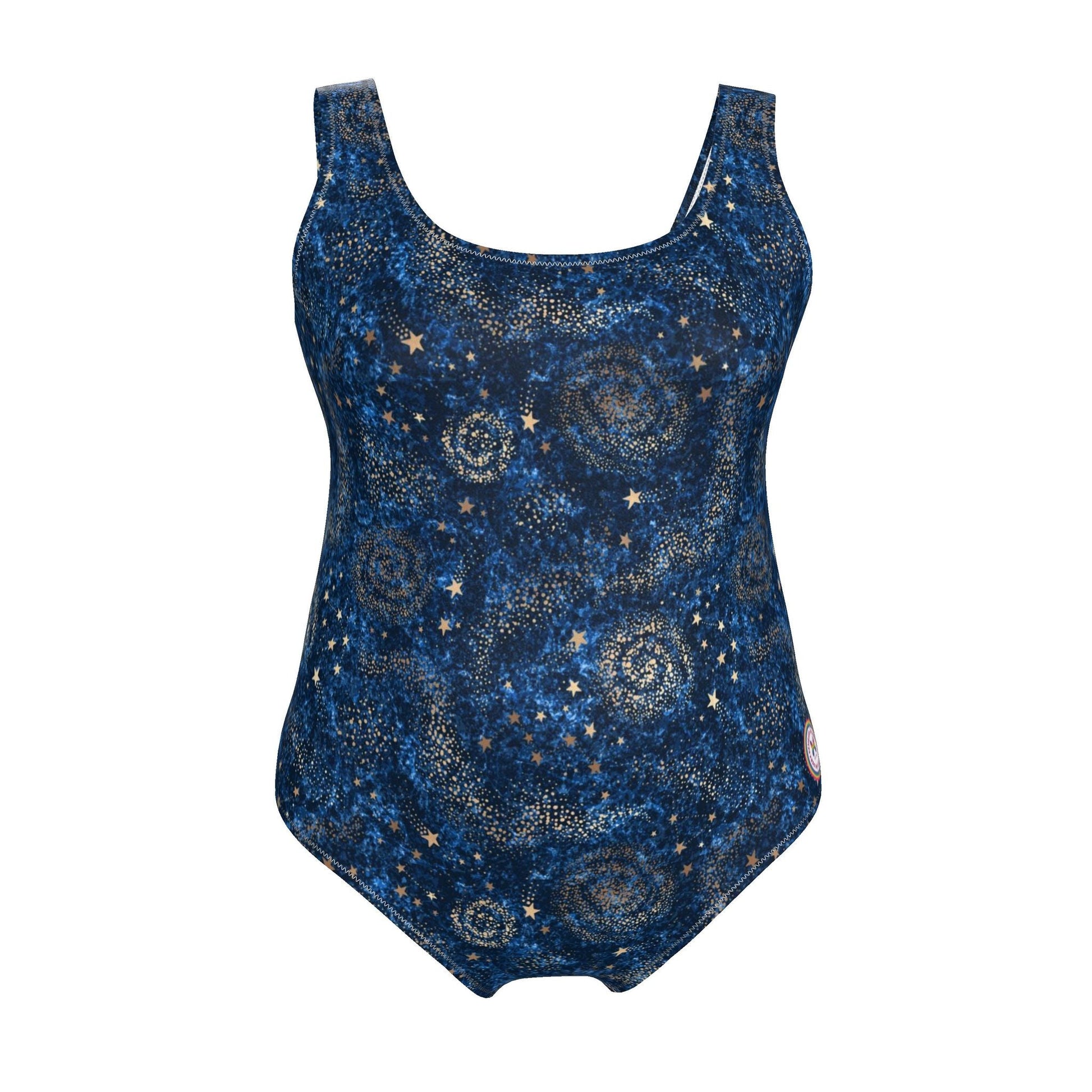 A woman modeling a one-piece swimsuit with a dark blue and black celestial print featuring stars and swirls, set against a solid light blue background.