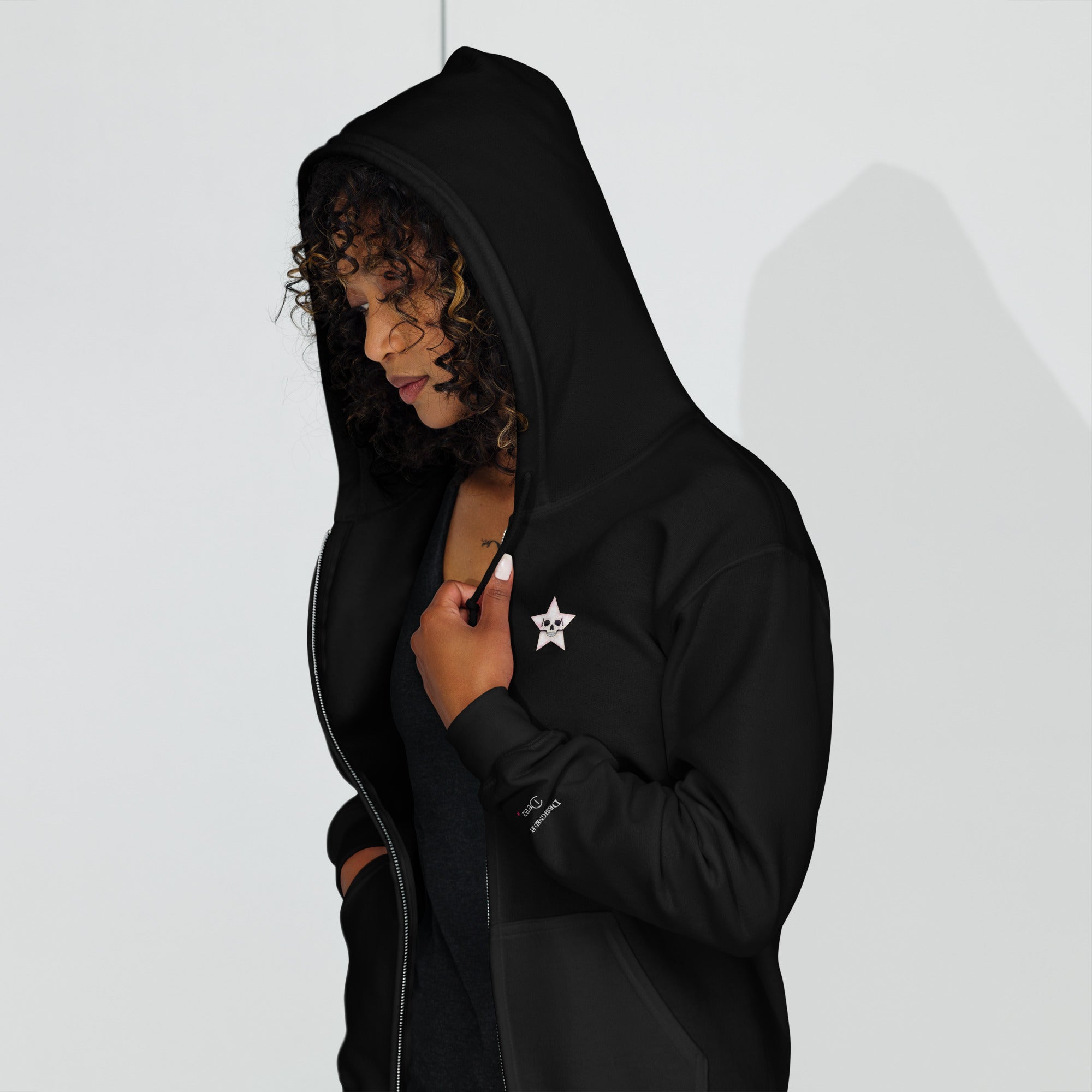 Black unisex zip hoodie featuring a Death Star skull graphic, made by Printful in a heavy-blend fabric.