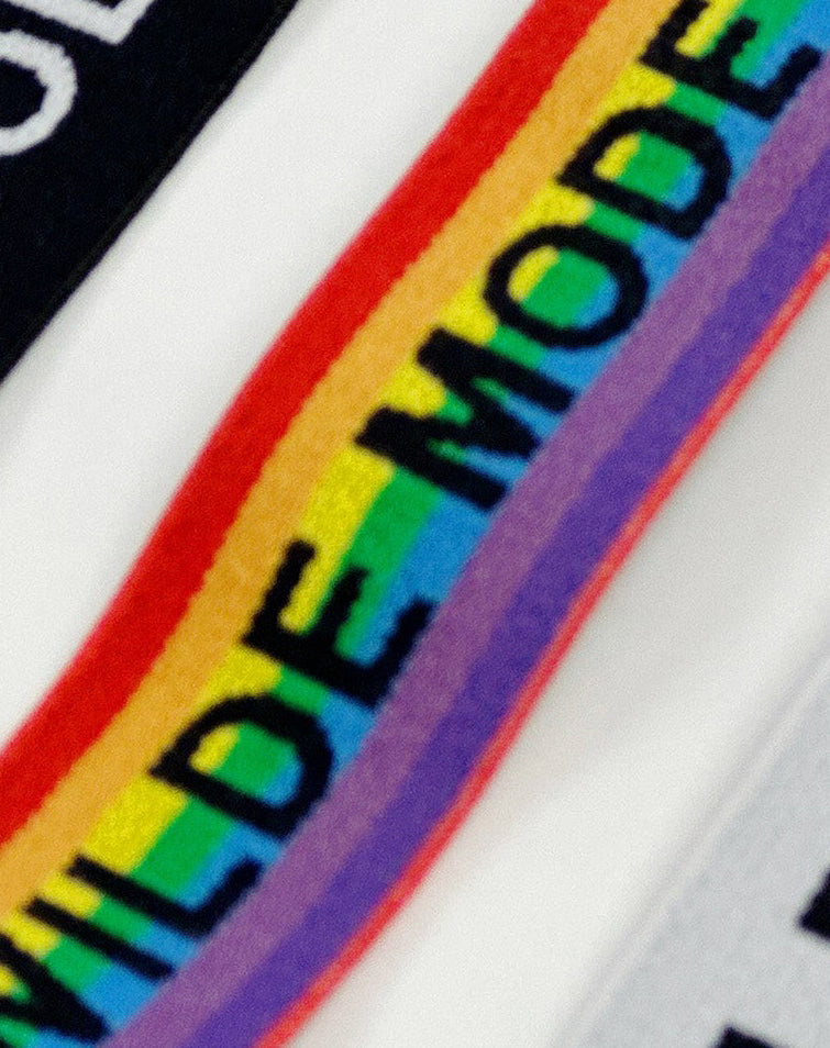 Rainbow-colored adjustable bra slider strap from Designed By Debz, a versatile bra accessory for custom fit and comfort.