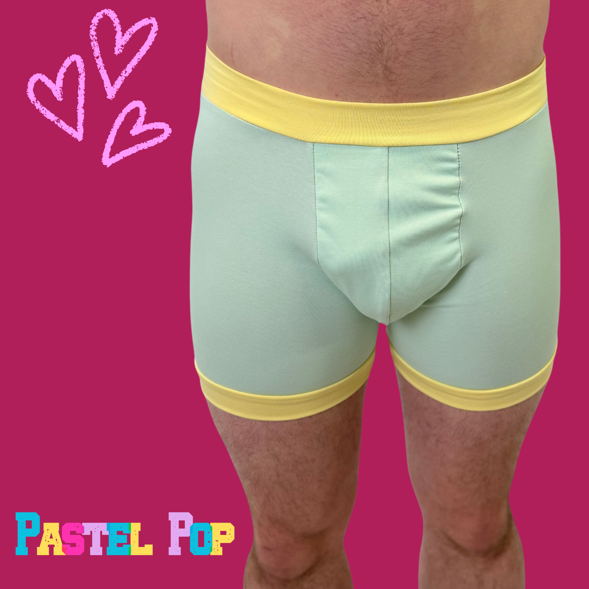 Pastel mint and yellow organic cotton boxer shorts from Designed By Debz Comfort Boxers, featuring a soft, breathable fabric.